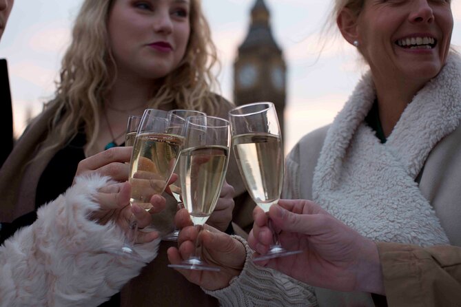 River Thames Evening Cruise with Sparkling wine and Canapés - HMS Belfast and Canary Wharf after dark