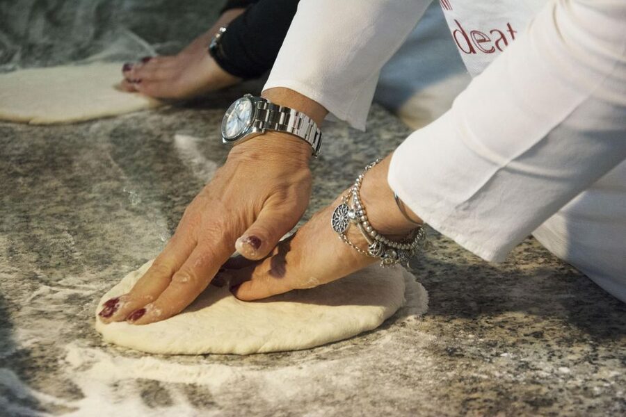 Rome: Hands-On Pizza Making Class near the Vatican with Wine - Sitting down to eat your own work