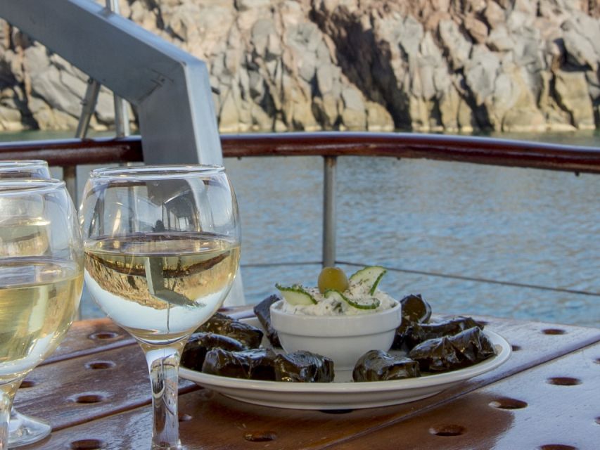 Santorini: Traditional Wooden Boat Tour with Meal and Wine - Red Beach and White Beach from the sea