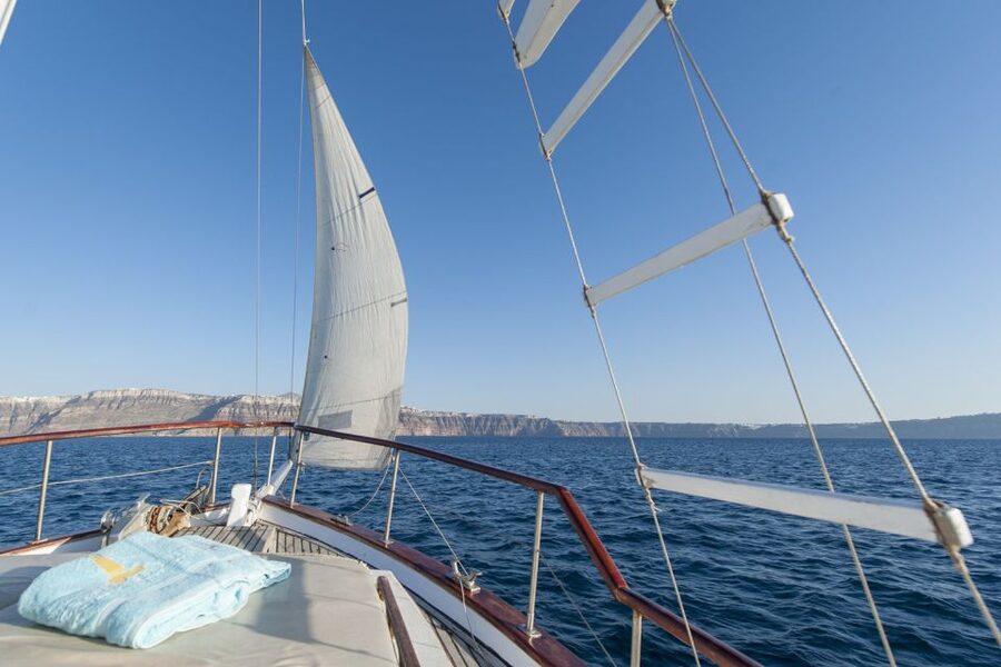 Santorini: Traditional Wooden Boat Tour with Meal and Wine - Swimming near Black Mountain