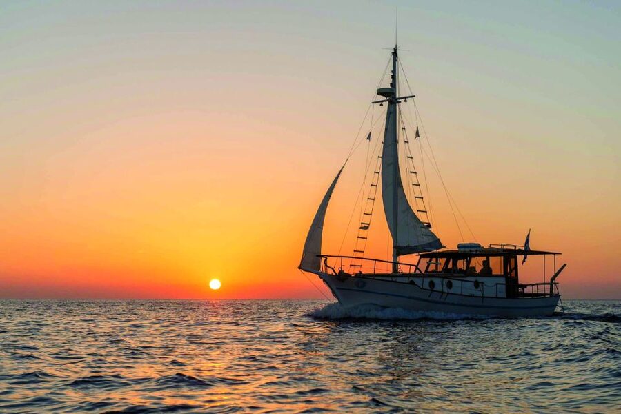 Santorini: Traditional Wooden Boat Tour with Meal and Wine - Snorkeling around Thirassia Island