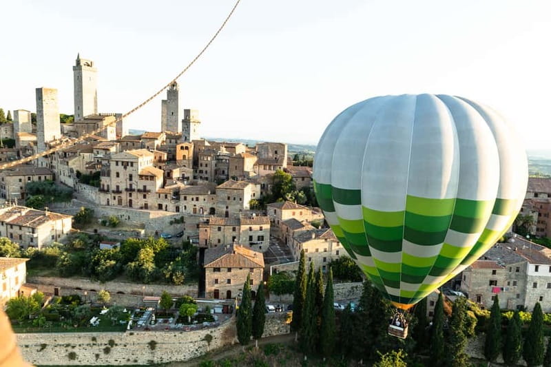 Siena: Balloon Flight Over Tuscany with a Glass of Wine - Landing in a Tuscan field