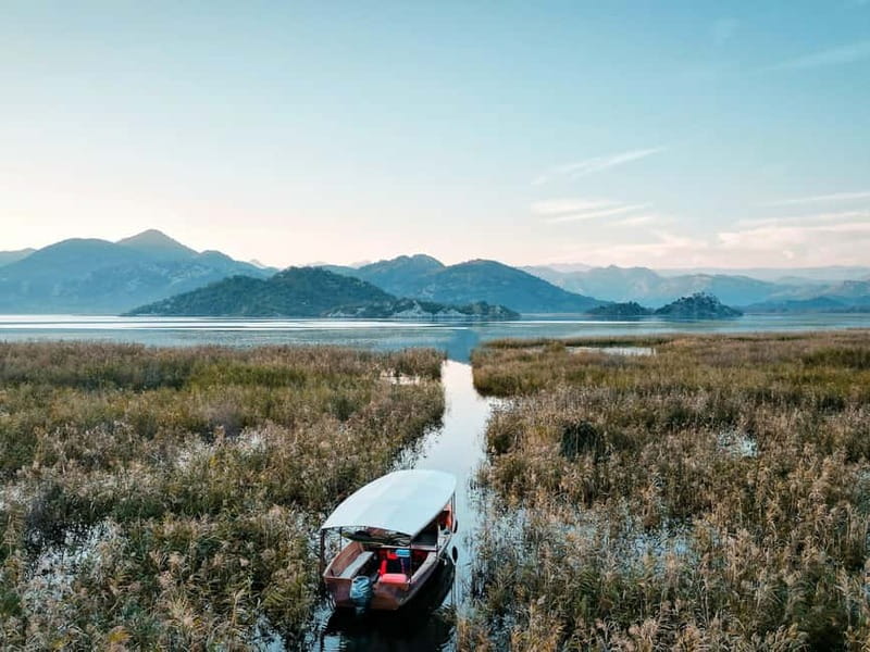 Skadar Lake: Guided Sunset Boat Tour with Wooden Boat & Wine - Leaving Virpazar on a traditional wooden boat