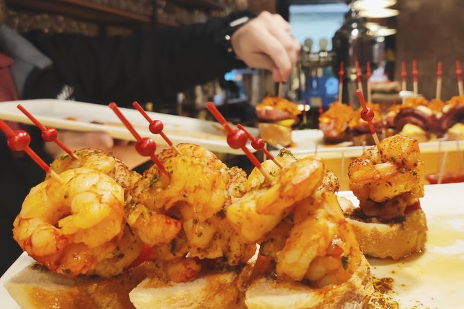 Spanish Wine and Tapas Tour in a Local Neighborhood in Barcelona - Stop one: the evening begins with a local bar