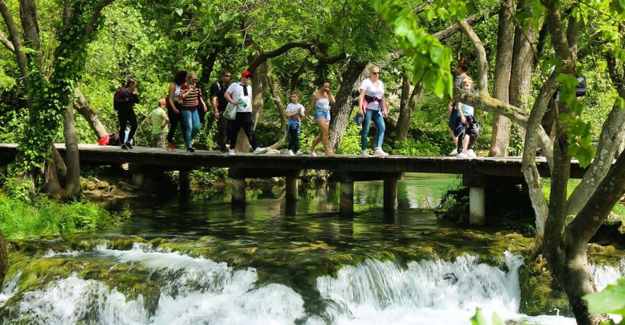 Split: Krka Waterfalls With Boat Cruise, Wine and Olive Oil - Walking the wooden paths around Skradinski buk