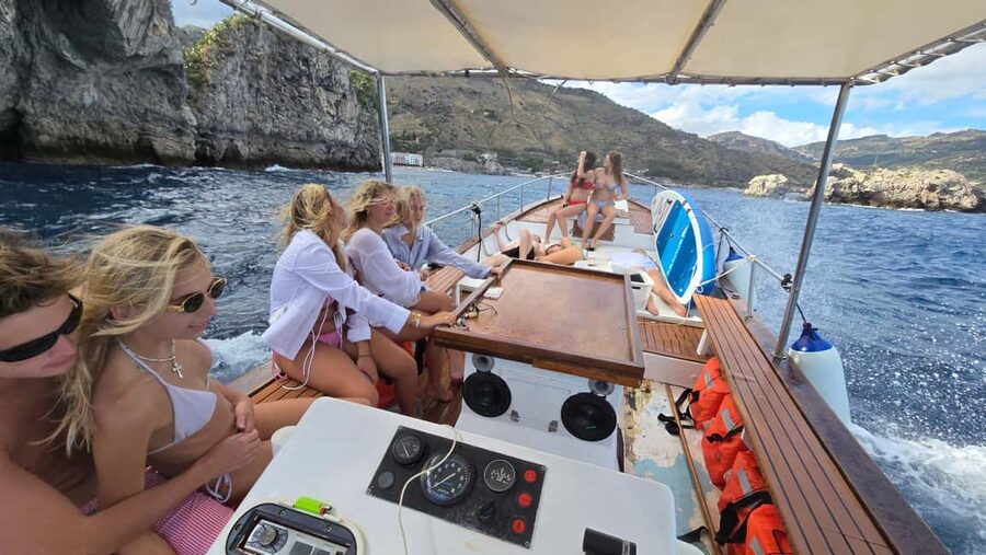 Taormina: Boat Tour with Sicilian Wine Tasting - Sicilian wine and a proper snack table