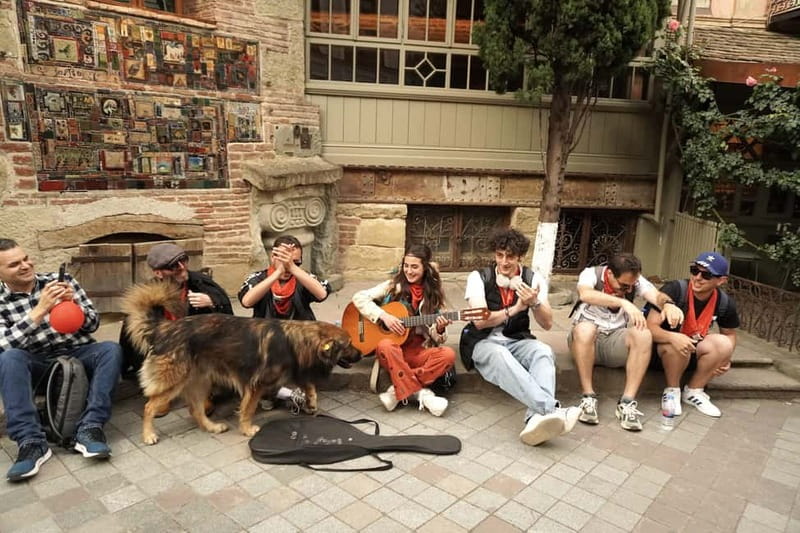 Tbilisi: Evening Walking Tour with Wine & Boat Ride Options - The Clock Tower and the art of Rezo Gabriadze