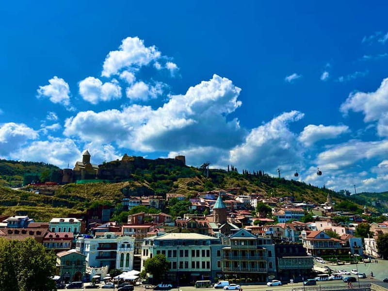 Tbilisi: Old & New City Guided Tour with 15 Tastings & Wine - Starting at a café, then crossing into Tbilisi’s old quarters
