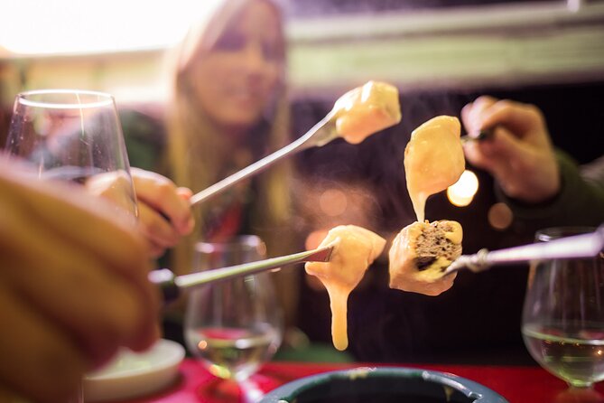 Zurich eTukTuk Private Tour - with Cheese Fondue and Wine - Limmatquai, the Rathaus, and the Riverfront